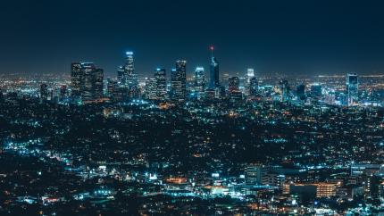 An image of a large city with beautiful lights in the background.