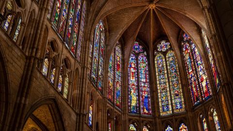 Large stained glass windows in a large cathedral.
