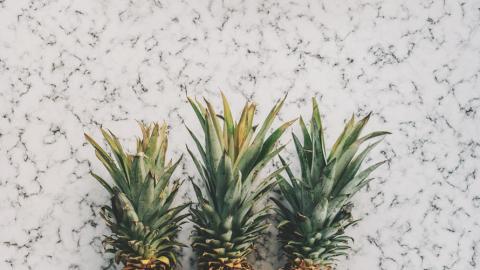 photo courtesy of pexels - https://www.pexels.com/photo/3-pineapple-fruit-on-white-and-grey-sand-189267/