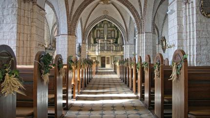 Image of church pews inside of an old church. Courtesy of Pixaby.