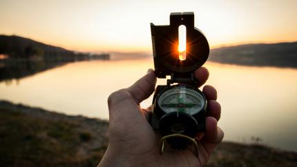A navigation compass pointed to the sun