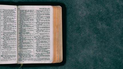 Bible sits on a blue background