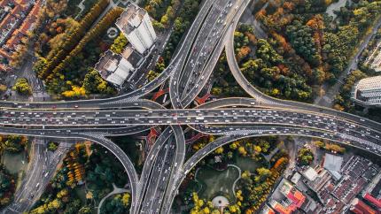 Roads converge in a multi-level highway intersection