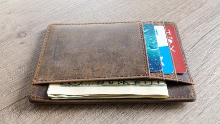Photo courtesy of Pexels: https://www.pexels.com/photo/brown-leather-wallet-and-us-dollar-banknote-915915/