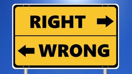 Yellow sign points in the direction of "right" and "wrong"
