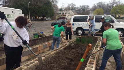 Community garden members prepare beds at Fuller Avenue Christian Reformed Church
