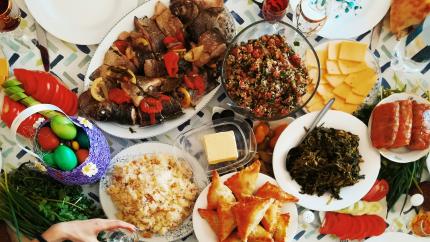 A feast is laid out across a table. Courtesy of Unsplash.