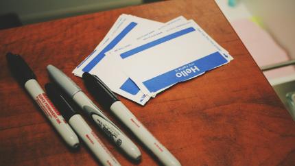 An image of a set of name tags. Courtesy of Jon Tyson on Unsplash.