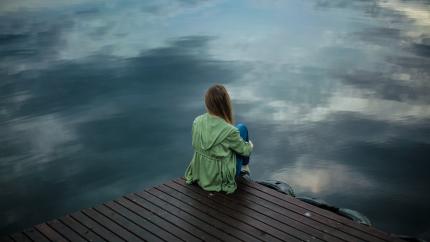 woman alone at lake