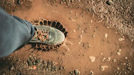 https://www.pexels.com/photo/man-wearing-gray-shoe-standing-on-brown-soil-1914815/