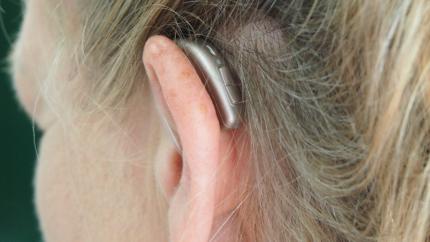 Image of hearing aide behind ear