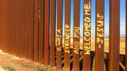 Matthew 25 text on border fencing