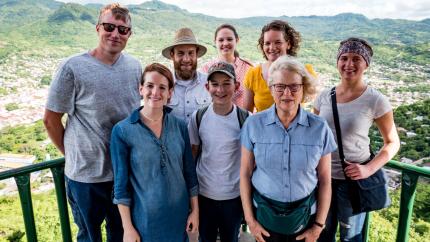 A group of volunteers stands at an overlook in Nicaragua