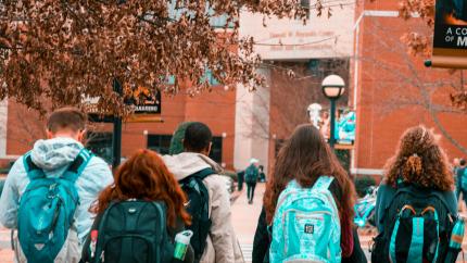An image of college students walking together. Courtesy of Pexels.