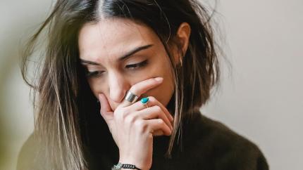 https://www.pexels.com/photo/lady-crying-with-hand-on-mouth-in-room-6383183/