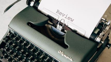 https://www.pexels.com/photo/black-and-white-typewriter-on-table-4065400/