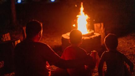 https://www.pexels.com/photo/father-with-his-sons-sitting-by-the-campfire-12932681/
