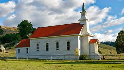 An image of a church in a field. Courtesy of Pixaby.
