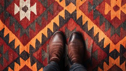 https://www.pexels.com/photo/person-in-brown-leather-boots-standing-on-rug-5863528/