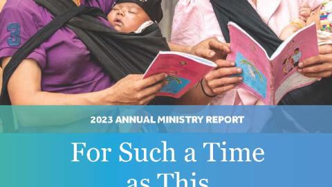 The cover of the 2023 CRCNA Annual Ministry Report. It depicts two women in Ka Chi, Laos talking about ways they are applying their training in maternal and child health from World Renew. The title says, "For Such a Time as This"