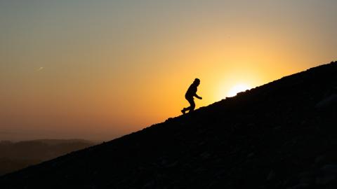 A person running up a hill