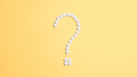 A white question mark stands against a yellow background. Courtesy of Pexels.