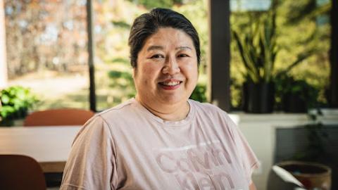 a headshot of Sandy Woo 