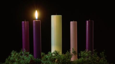 Five Advent candles with only one lit