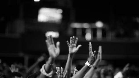 https://www.pexels.com/photo/grayscale-photography-of-people-raising-hands-2014775/