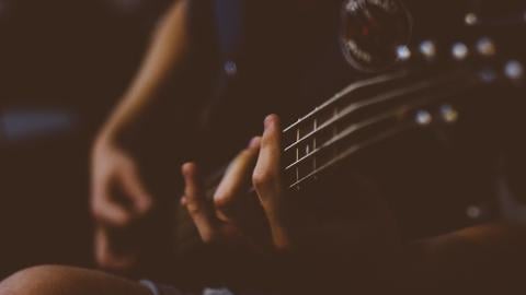 https://www.pexels.com/photo/person-playing-guitar-130991/
