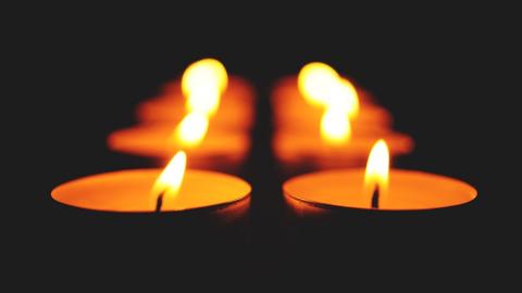 https://www.pexels.com/photo/close-up-of-illuminated-candle-against-black-background-330216/