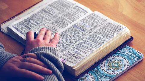 Photo courtesy of Pexels: https://www.pexels.com/photo/person-reading-bible-on-brown-table-38048/