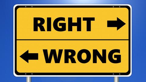 Yellow sign points in the direction of "right" and "wrong"