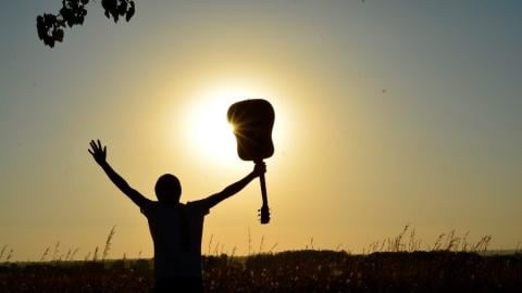 photo courtesy of pexels - https://www.pexels.com/photo/silhouette-of-man-holding-guitar-on-plant-fields-at-daytime-89909/