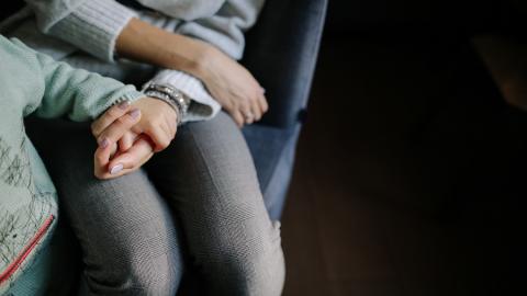 https://www.pexels.com/photo/sitting-woman-in-gray-long-sleeved-shirt-holding-baby-s-hand-in-blue-long-sleeved-shirt-1684038/