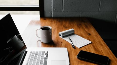 https://www.pexels.com/photo/macbook-pro-on-brown-wooden-table-2312369/