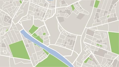 Image content: a digital illustration of a map with white streets on a gray background, with green sections and a body of water