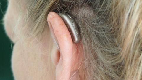 Image of hearing aide behind ear