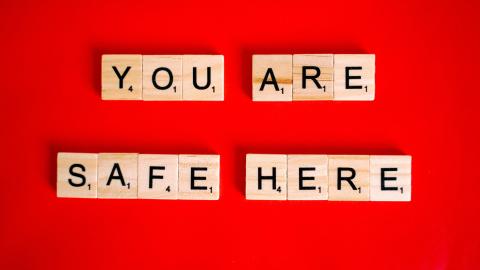 A red background with the text "You Are Safe Here"