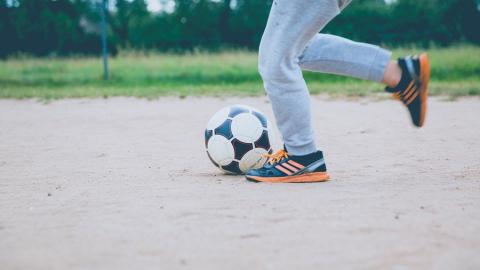 photo courtesy of pexels - https://www.pexels.com/photo/person-kicking-soccer-ball-on-gray-sand-168872/