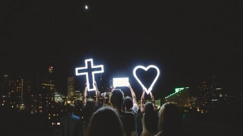 photo courtesy of pexels - https://www.pexels.com/photo/man-and-lady-raising-cross-heart-led-light-photo-during-night-time-24667/