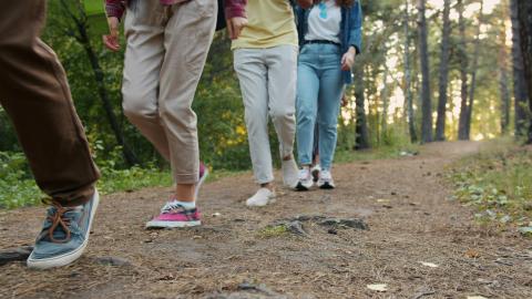 teenagers walking down a path