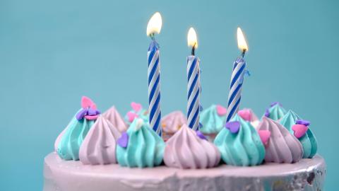 Image of a birthday cake with candles. Courtesy of Pexels.